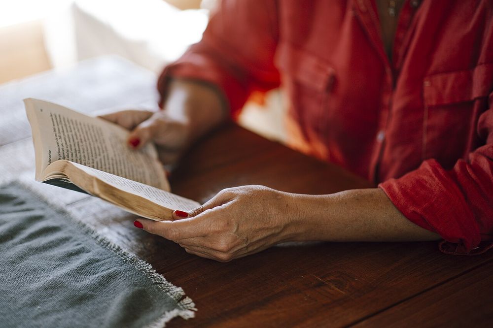Reading a book in a quiet library