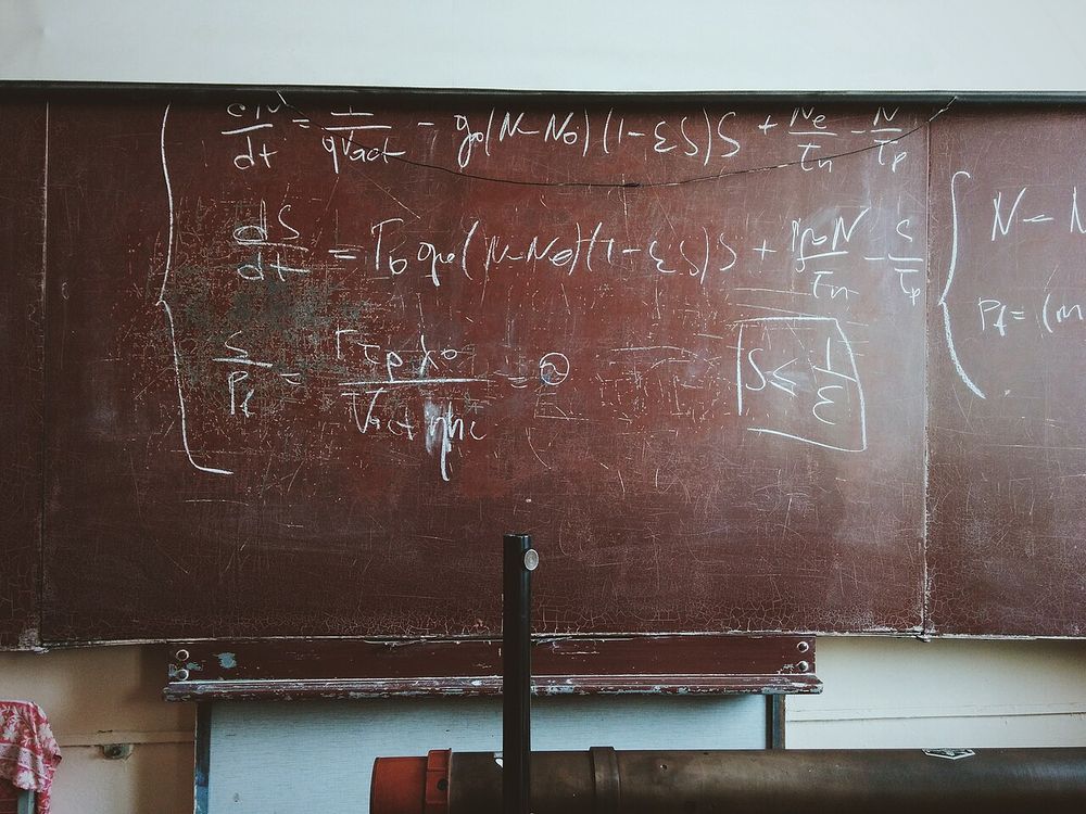 Mathematics formulas chalked on a blackboard